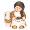 Little girl with ceramic olives, Classic Nativity scene